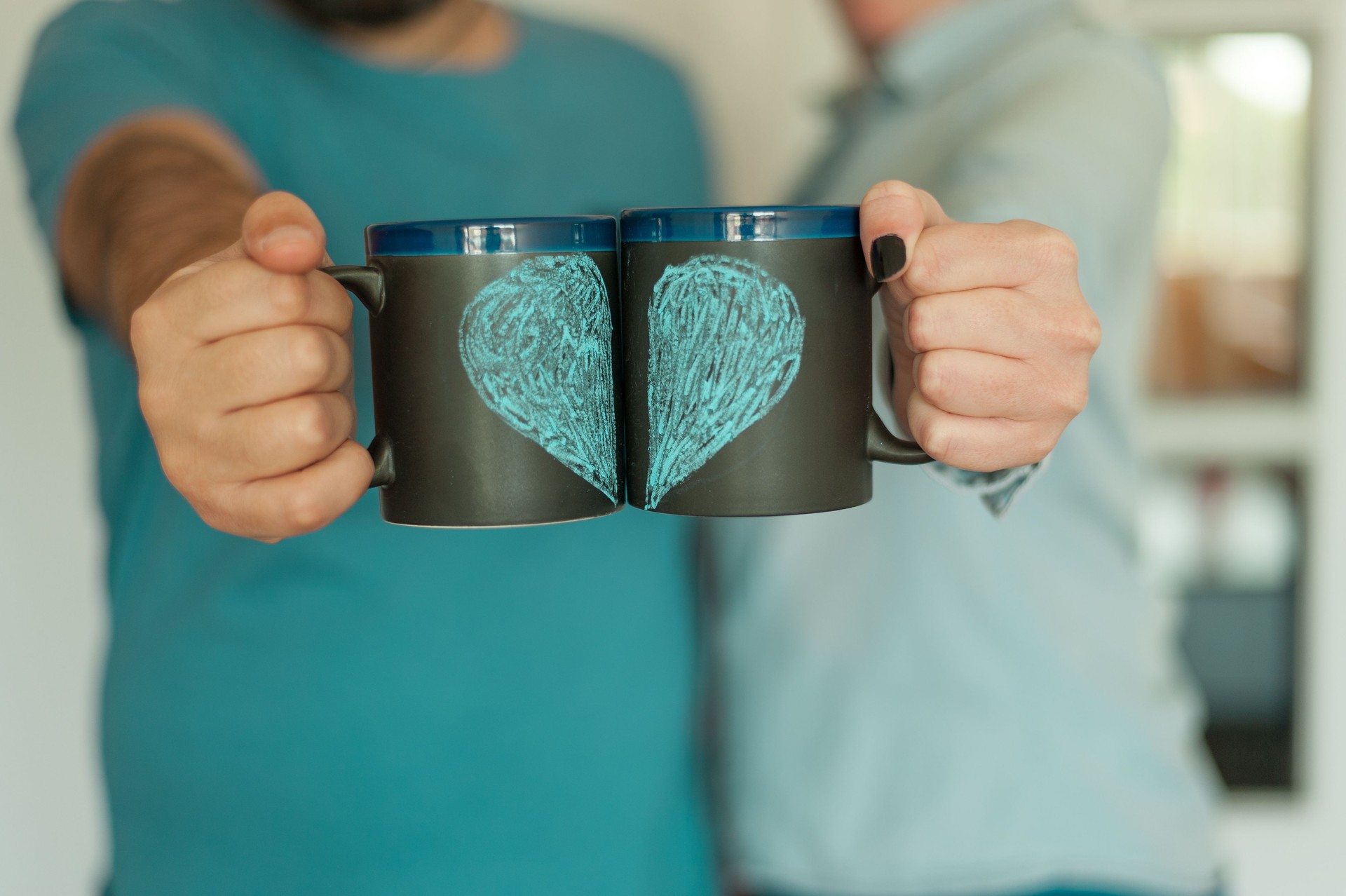 Couple holding mugs
